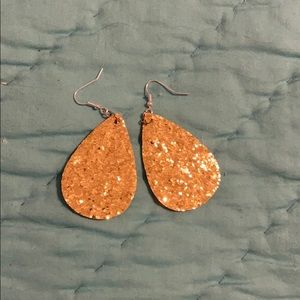 Gold glittery earrings.